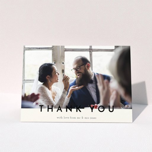 A wedding thank you card design called "Split thank you ". It is an A5 card in a landscape orientation. It is a photographic wedding thank you card with room for 1 photo. "Split thank you " is available as a folded card, with mainly cream colouring.