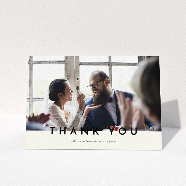 A wedding thank you card design called "Split thank you ". It is an A5 card in a landscape orientation. It is a photographic wedding thank you card with room for 1 photo. "Split thank you " is available as a folded card, with mainly cream colouring.