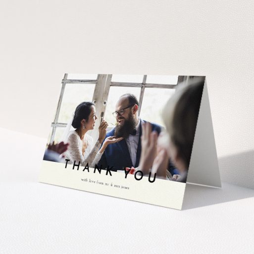 A wedding thank you card design called 'Split thank you '. It is an A5 card in a landscape orientation. It is a photographic wedding thank you card with room for 1 photo. 'Split thank you ' is available as a folded card, with mainly cream colouring.