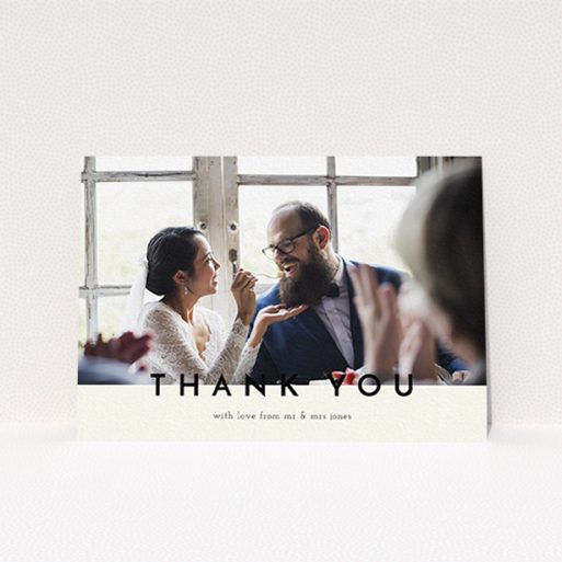 A wedding thank you card named "Split thank you ". It is an A6 card in a landscape orientation. It is a photographic wedding thank you card with room for 1 photo. "Split thank you " is available as a flat card, with mainly cream colouring.