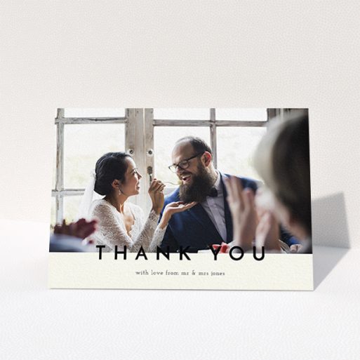 A wedding thank you card design titled "Split thank you ". It is an A6 card in a landscape orientation. It is a photographic wedding thank you card with room for 1 photo. "Split thank you " is available as a folded card, with mainly cream colouring.