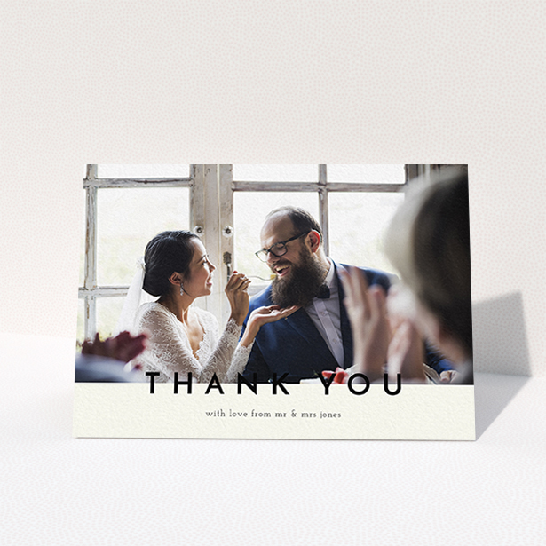 A wedding thank you card design titled "Split thank you ". It is an A6 card in a landscape orientation. It is a photographic wedding thank you card with room for 1 photo. "Split thank you " is available as a folded card, with mainly cream colouring.