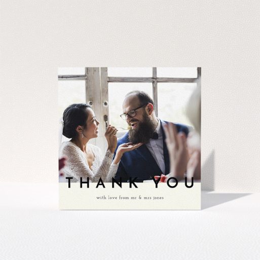 A wedding thank you card called "Split thank you ". It is a square (148mm x 148mm) card in a square orientation. It is a photographic wedding thank you card with room for 1 photo. "Split thank you " is available as a folded card, with mainly cream colouring.