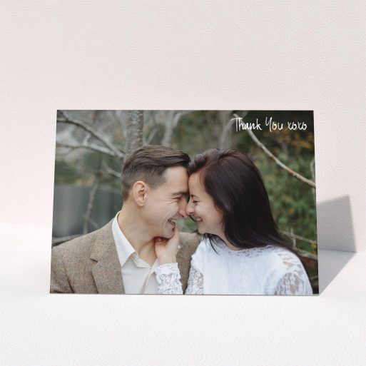 A wedding thank you card template titled "Thank You XOXO". It is an A5 card in a landscape orientation. It is a photographic wedding thank you card with room for 1 photo. "Thank You XOXO" is available as a folded card, with mainly white colouring.