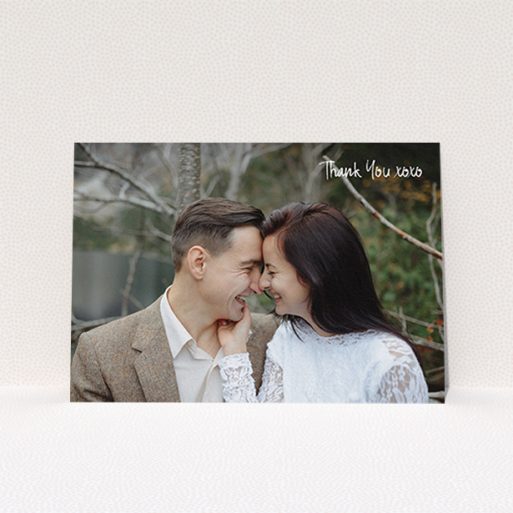 A wedding thank you card design titled "Thank You XOXO". It is an A6 card in a landscape orientation. It is a photographic wedding thank you card with room for 1 photo. "Thank You XOXO" is available as a flat card, with mainly white colouring.