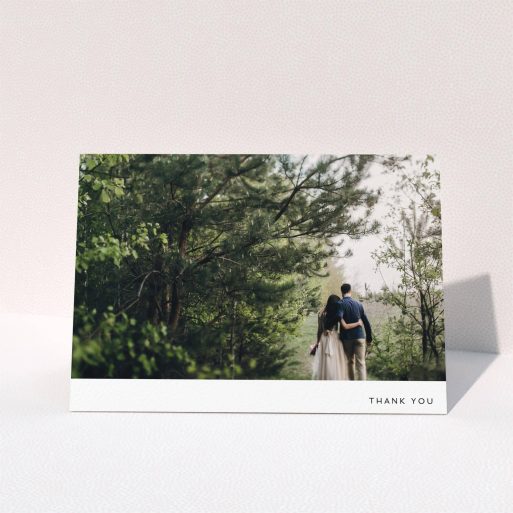 A wedding thank you card design called "Thankful with Simplicity". It is an A5 card in a landscape orientation. It is a photographic wedding thank you card with room for 1 photo. "Thankful with Simplicity" is available as a folded card, with mainly white colouring.
