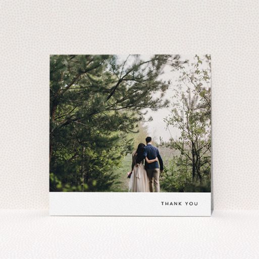 A wedding thank you card design titled "Thankful with Simplicity". It is a square (148mm x 148mm) card in a square orientation. It is a photographic wedding thank you card with room for 1 photo. "Thankful with Simplicity" is available as a flat card, with mainly white colouring.