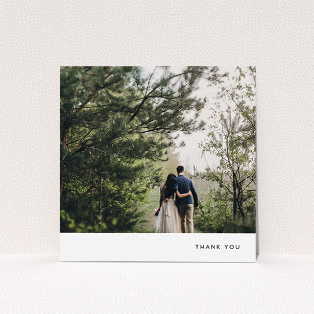 A wedding thank you card design titled "Thankful with Simplicity". It is a square (148mm x 148mm) card in a square orientation. It is a photographic wedding thank you card with room for 1 photo. "Thankful with Simplicity" is available as a flat card, with mainly white colouring.