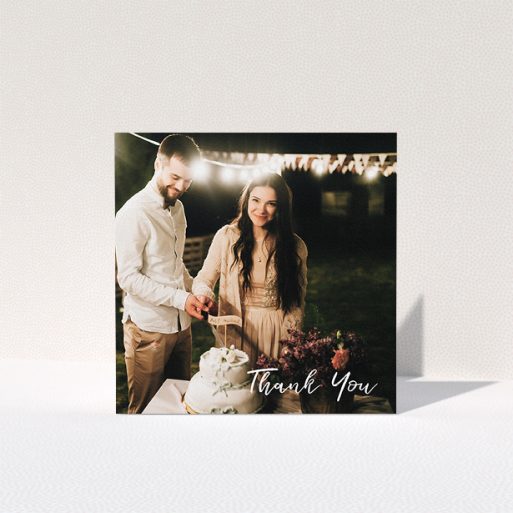 A wedding thank you card named "Thanks From The Corner". It is a square (148mm x 148mm) card in a square orientation. It is a photographic wedding thank you card with room for 1 photo. "Thanks From The Corner" is available as a folded card, with mainly white colouring.