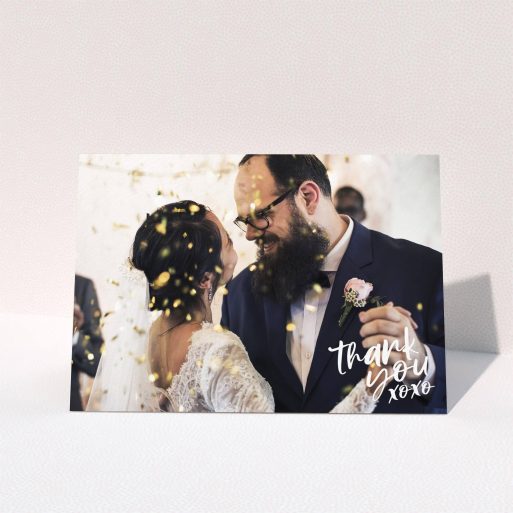 A wedding thank you card design called "Thanks In the Corner". It is an A5 card in a landscape orientation. It is a photographic wedding thank you card with room for 1 photo. "Thanks In the Corner" is available as a folded card, with mainly white colouring.