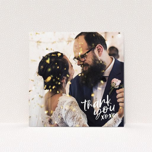 A wedding thank you card named "Thanks In the Corner". It is a square (148mm x 148mm) card in a square orientation. It is a photographic wedding thank you card with room for 1 photo. "Thanks In the Corner" is available as a flat card, with mainly white colouring.