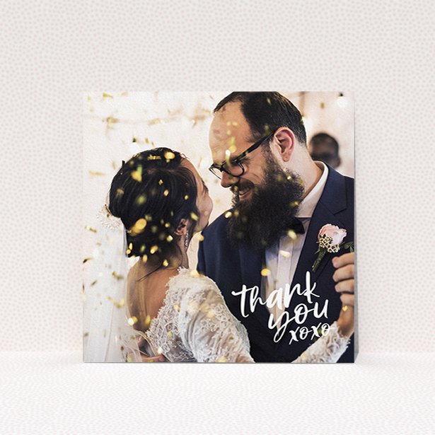 A wedding thank you card named "Thanks In the Corner". It is a square (148mm x 148mm) card in a square orientation. It is a photographic wedding thank you card with room for 1 photo. "Thanks In the Corner" is available as a flat card, with mainly white colouring.