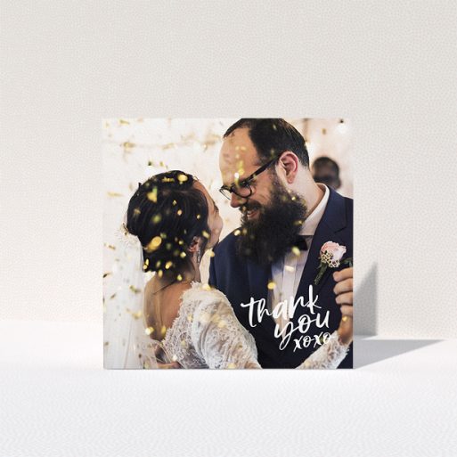 A wedding thank you card template titled "Thanks In the Corner". It is a square (148mm x 148mm) card in a square orientation. It is a photographic wedding thank you card with room for 1 photo. "Thanks In the Corner" is available as a folded card, with mainly white colouring.