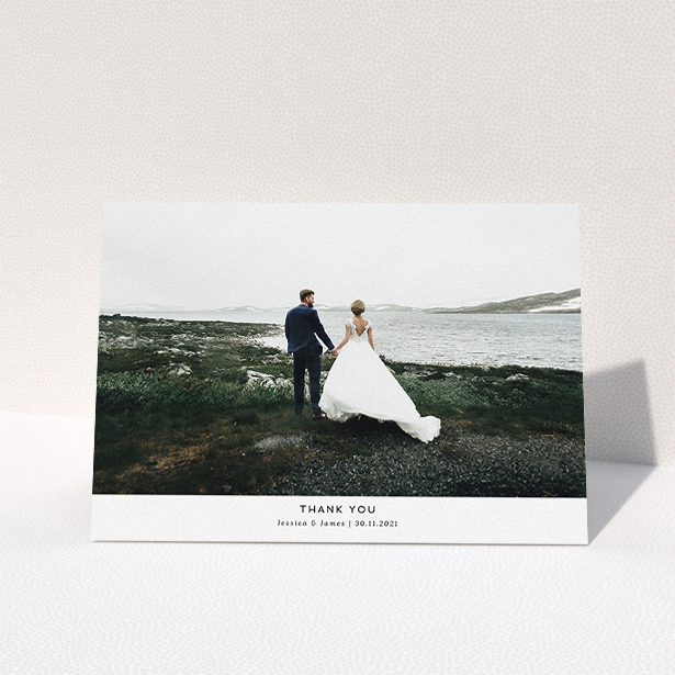 A wedding thank you card called "THE Wedding Photo Thank You". It is an A5 card in a landscape orientation. It is a photographic wedding thank you card with room for 1 photo. "THE Wedding Photo Thank You" is available as a folded card, with mainly white colouring.