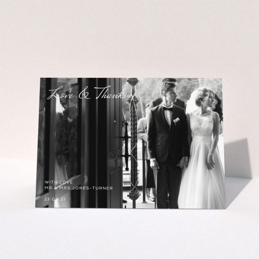 A wedding thank you card template titled "To the Left Photo". It is an A5 card in a landscape orientation. It is a photographic wedding thank you card with room for 1 photo. "To the Left Photo" is available as a folded card, with mainly white colouring.