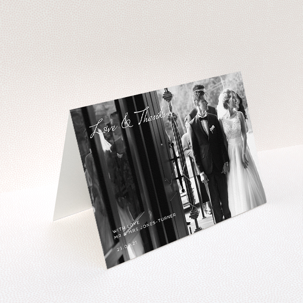 A wedding thank you card template titled "To the Left Photo". It is an A5 card in a landscape orientation. It is a photographic wedding thank you card with room for 1 photo. "To the Left Photo" is available as a folded card, with mainly white colouring.