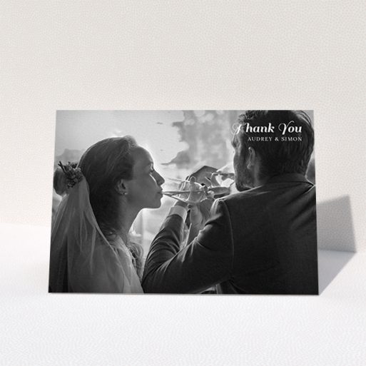 A wedding thank you card named "Top-Right". It is an A6 card in a landscape orientation. It is a photographic wedding thank you card with room for 1 photo. "Top-Right" is available as a folded card, with mainly white colouring.