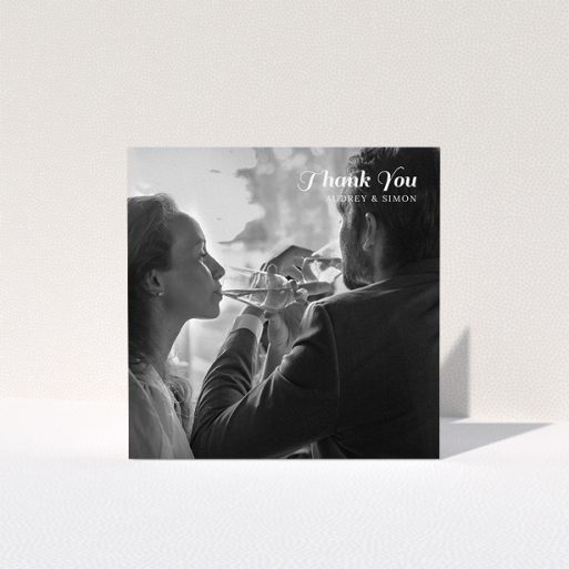 A wedding thank you card named "Top-Right". It is a square (148mm x 148mm) card in a square orientation. It is a photographic wedding thank you card with room for 1 photo. "Top-Right" is available as a folded card, with mainly white colouring.