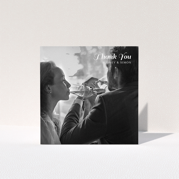 A wedding thank you card named "Top-Right". It is a square (148mm x 148mm) card in a square orientation. It is a photographic wedding thank you card with room for 1 photo. "Top-Right" is available as a folded card, with mainly white colouring.