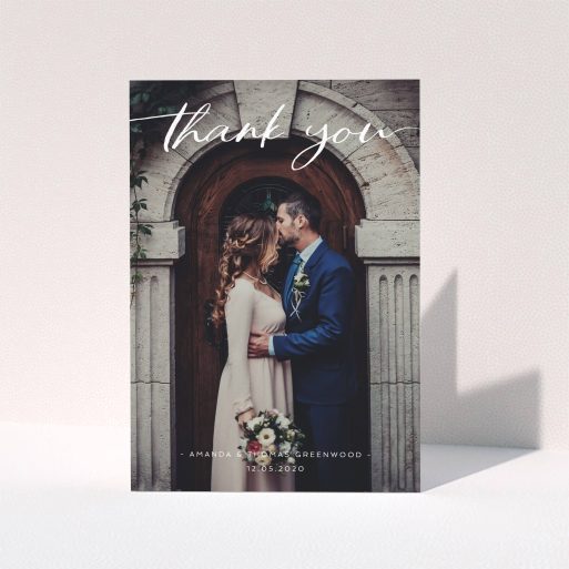 A wedding thank you card called "Topped and Bottomed". It is an A5 card in a portrait orientation. It is a photographic wedding thank you card with room for 1 photo. "Topped and Bottomed" is available as a folded card, with mainly white colouring.