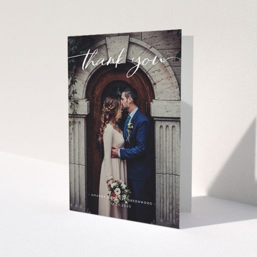 A wedding thank you card called 'Topped and Bottomed'. It is an A5 card in a portrait orientation. It is a photographic wedding thank you card with room for 1 photo. 'Topped and Bottomed' is available as a folded card, with mainly white colouring.