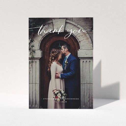 A wedding thank you card called "Topped and Bottomed". It is an A6 card in a portrait orientation. It is a photographic wedding thank you card with room for 1 photo. "Topped and Bottomed" is available as a folded card, with mainly white colouring.