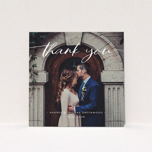 A wedding thank you card design called "Topped and Bottomed". It is a square (148mm x 148mm) card in a square orientation. It is a photographic wedding thank you card with room for 1 photo. "Topped and Bottomed" is available as a flat card, with mainly white colouring.