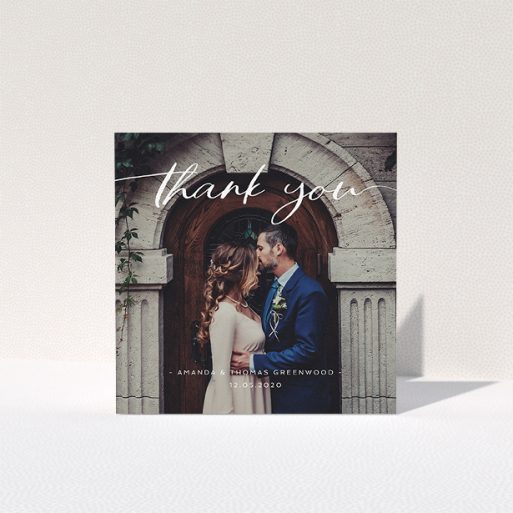 A wedding thank you card named "Topped and Bottomed". It is a square (148mm x 148mm) card in a square orientation. It is a photographic wedding thank you card with room for 1 photo. "Topped and Bottomed" is available as a folded card, with mainly white colouring.