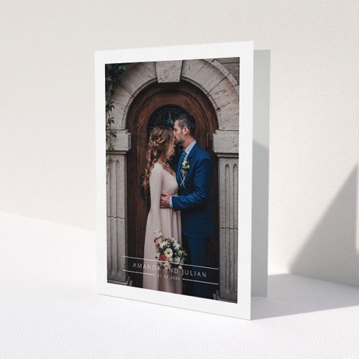 A wedding thank you card named 'Tramlines'. It is an A5 card in a portrait orientation. It is a photographic wedding thank you card with room for 1 photo. 'Tramlines' is available as a folded card, with mainly white colouring.