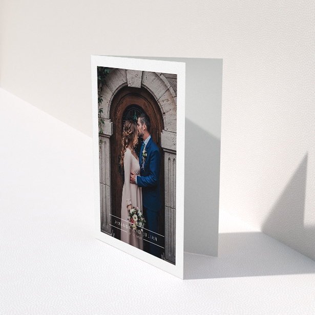 A wedding thank you card named "Tramlines". It is an A5 card in a portrait orientation. It is a photographic wedding thank you card with room for 1 photo. "Tramlines" is available as a folded card, with mainly white colouring.