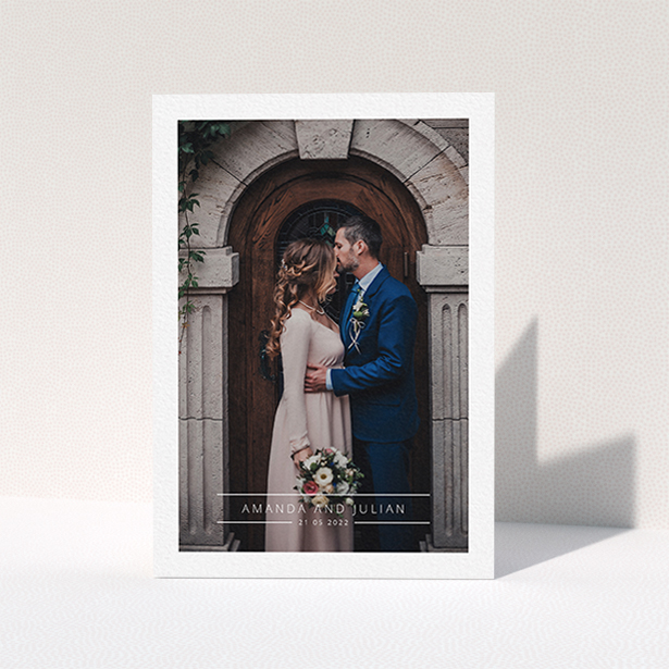 A wedding thank you card design titled "Tramlines". It is an A6 card in a portrait orientation. It is a photographic wedding thank you card with room for 1 photo. "Tramlines" is available as a folded card, with mainly white colouring.