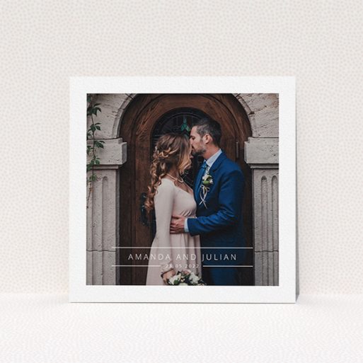 A wedding thank you card design titled "Tramlines". It is a square (148mm x 148mm) card in a square orientation. It is a photographic wedding thank you card with room for 1 photo. "Tramlines" is available as a flat card, with mainly white colouring.