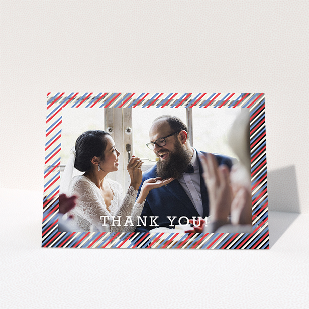 A wedding thank you card named "Tricolour Photo Frame". It is an A5 card in a landscape orientation. It is a photographic wedding thank you card with room for 1 photo. "Tricolour Photo Frame" is available as a folded card, with mainly white colouring.