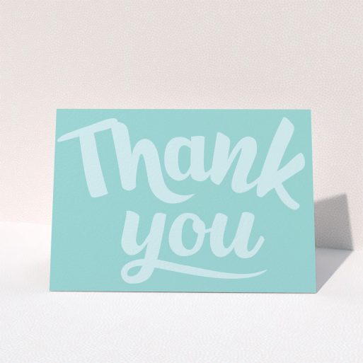 A wedding thank you card design named "Typography thank you". It is an A5 card in a landscape orientation. "Typography thank you" is available as a folded card, with mainly blue colouring.