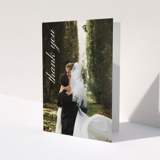 A wedding thank you card called 'Up the Side'. It is an A5 card in a portrait orientation. It is a photographic wedding thank you card with room for 1 photo. 'Up the Side' is available as a folded card, with mainly white colouring.
