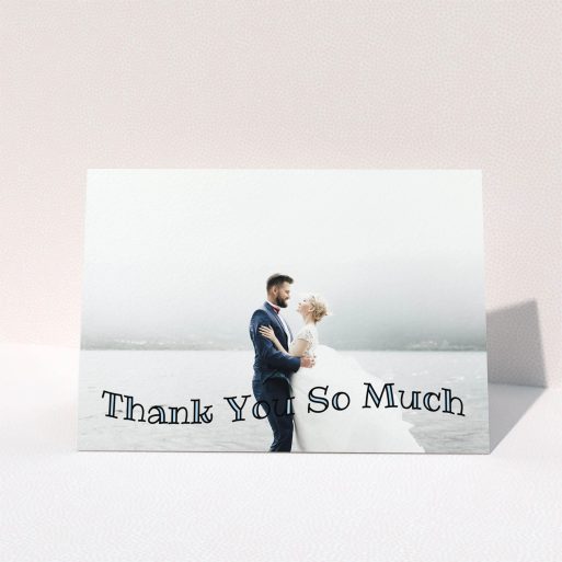A wedding thank you card design named "Wave of Thanks". It is an A6 card in a landscape orientation. It is a photographic wedding thank you card with room for 1 photo. "Wave of Thanks" is available as a folded card, with mainly blue colouring.