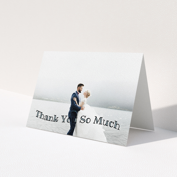 A wedding thank you card design named "Wave of Thanks". It is an A6 card in a landscape orientation. It is a photographic wedding thank you card with room for 1 photo. "Wave of Thanks" is available as a folded card, with mainly blue colouring.