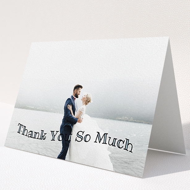 A wedding thank you card design named "Wave of Thanks". It is an A6 card in a landscape orientation. It is a photographic wedding thank you card with room for 1 photo. "Wave of Thanks" is available as a folded card, with mainly blue colouring.