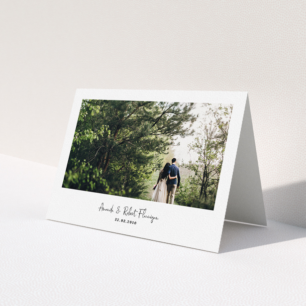 A wedding thank you card called "White Space with Photo". It is an A5 card in a landscape orientation. It is a photographic wedding thank you card with room for 1 photo. "White Space with Photo" is available as a folded card, with mainly white colouring.