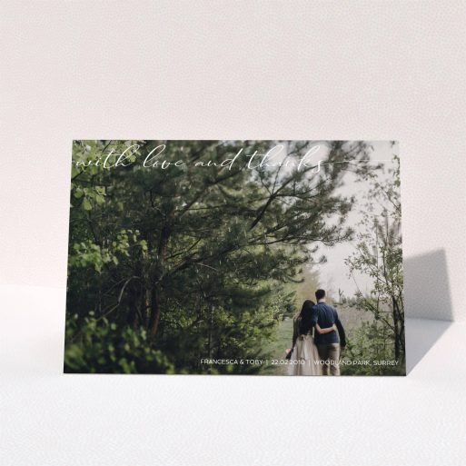 Wedding Thank You Card Design - "With Love And Thanks" A wedding thank you card design titled "With Love And Thanks". It is an A5 card in a landscape orientation. It is a photographic wedding thank you card with room for 1 photo. "With Love And Thanks" is available as a folded card, with mainly white colouring.