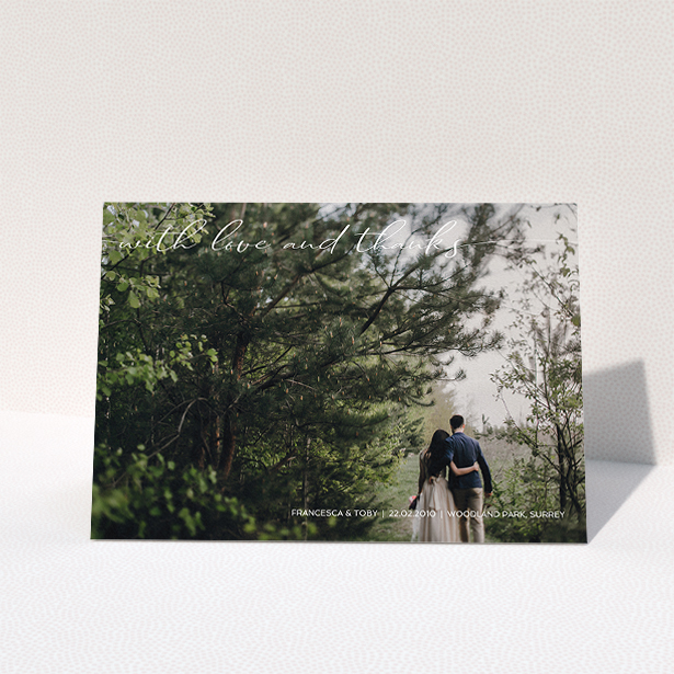 A wedding thank you card design titled "With Love And Thanks". It is an A5 card in a landscape orientation. It is a photographic wedding thank you card with room for 1 photo. "With Love And Thanks" is available as a folded card, with mainly white colouring.