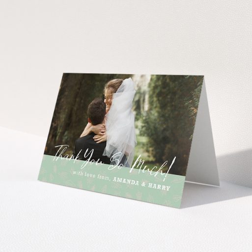 A wedding thank you card design called 'Woodland Footer'. It is an A5 card in a landscape orientation. It is a photographic wedding thank you card with room for 1 photo. 'Woodland Footer' is available as a folded card, with tones of green and white.
