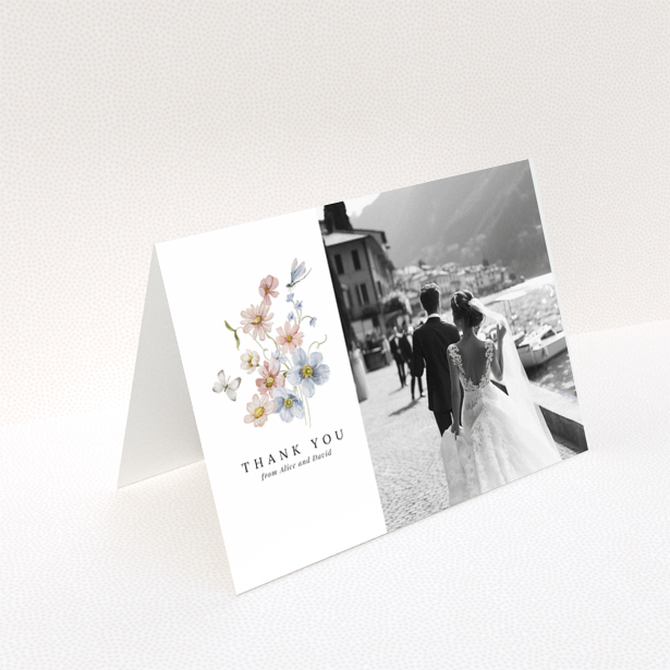 Wedding thank you card design with floral illustration and a photo of a bride and groom.