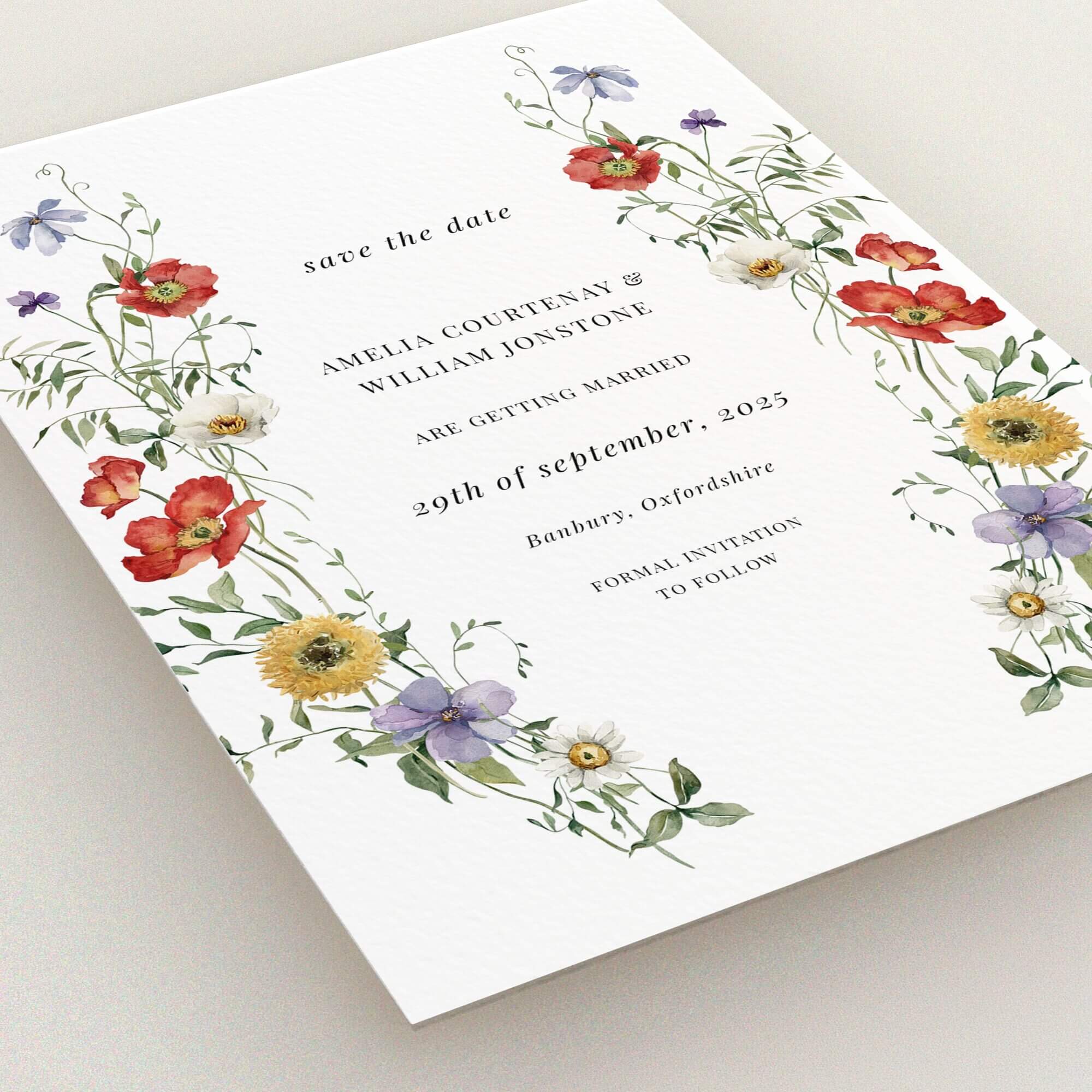 Floral wedding save the date card design with two decorative photo elements