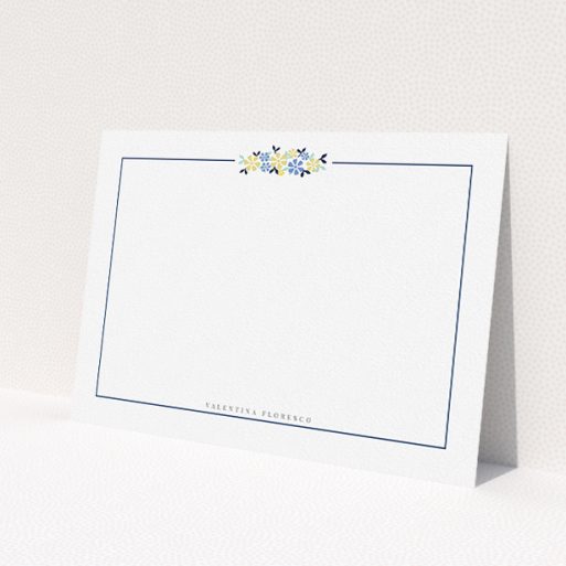 A womens correspondence card design named 'Surrounded by flowers'. It is an A5 card in a landscape orientation. 'Surrounded by flowers' is available as a flat card, with tones of white and blue.