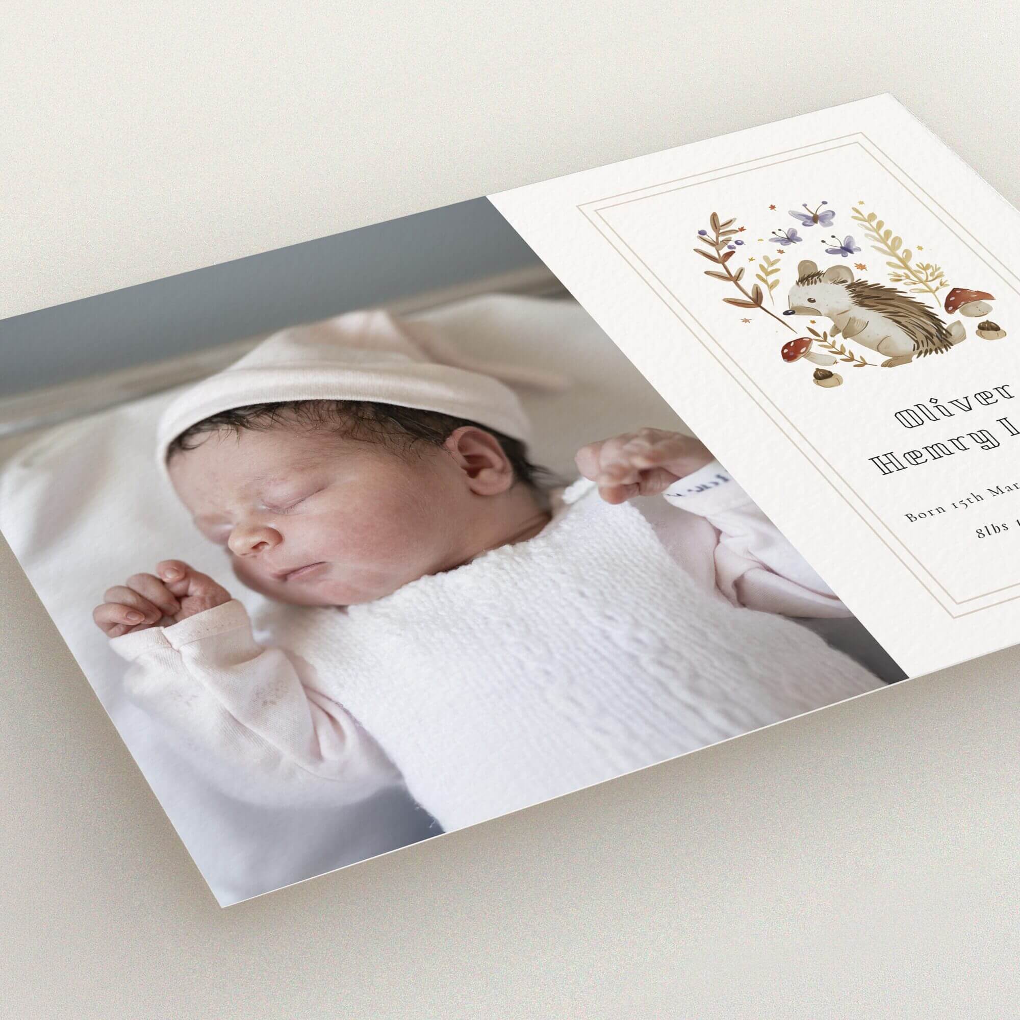 Birth announcement card design featuring one photo of a newborn baby next to an illustrated woodland theme.