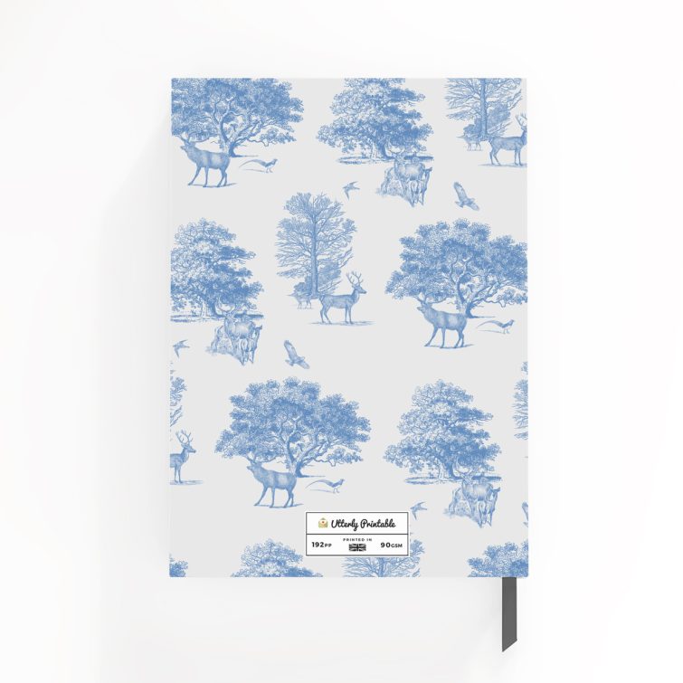 Blue and white nature-themed notebook cover design with illustrations of deer and trees, featuring one central photo placeholder.