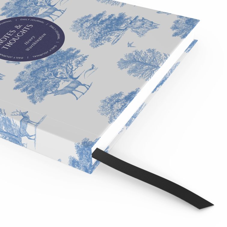 Blue and white nature-themed notebook cover design with illustrations of deer and trees, featuring one central photo placeholder.