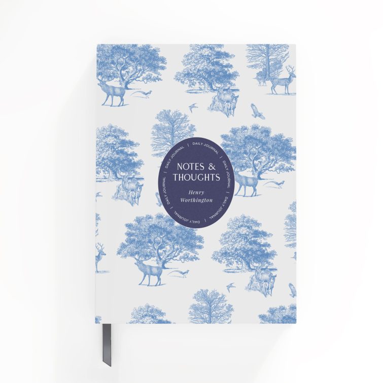 Blue and white nature-themed notebook cover design with illustrations of deer and trees, featuring one central photo placeholder.