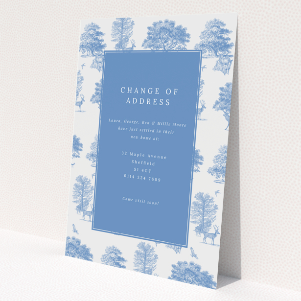 Change of address card with blue and white nature-themed design, featuring two photos of trees and deer.